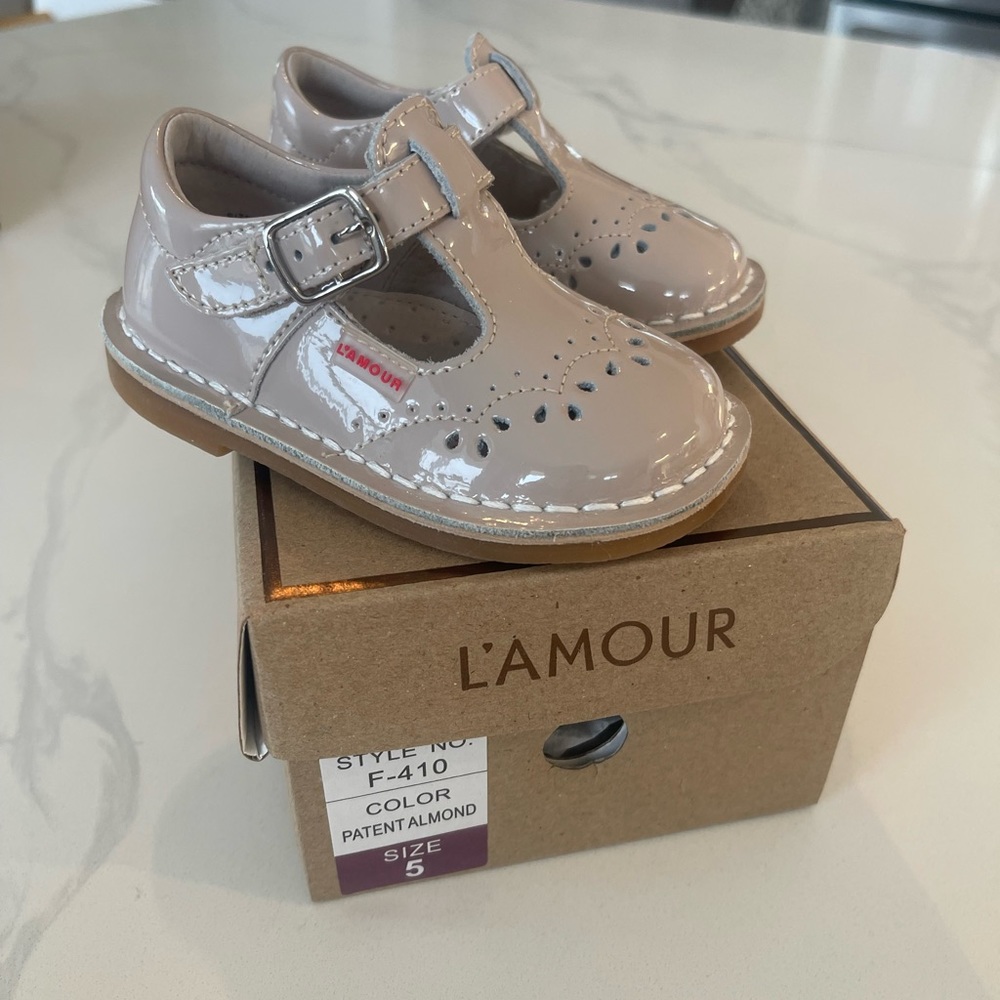 L'AMOUR

Ruthie T-Strap Stitched Patent Mary Jane, nude